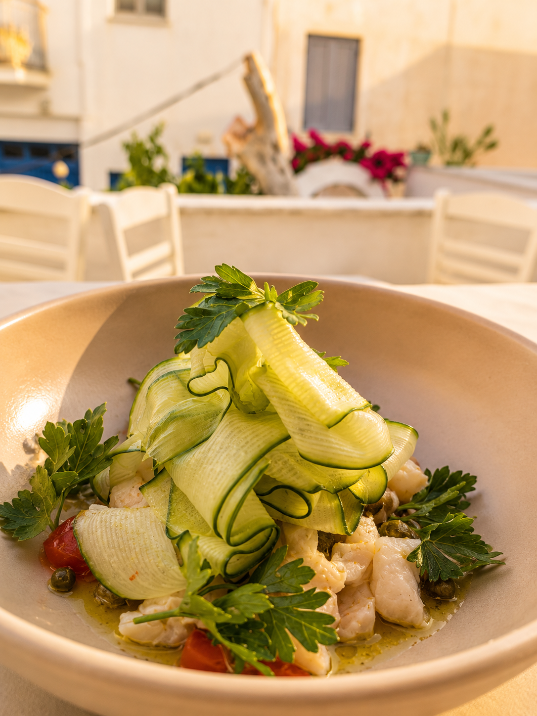 Sea bass ceviche with shaved cucumber, capers and parsley.