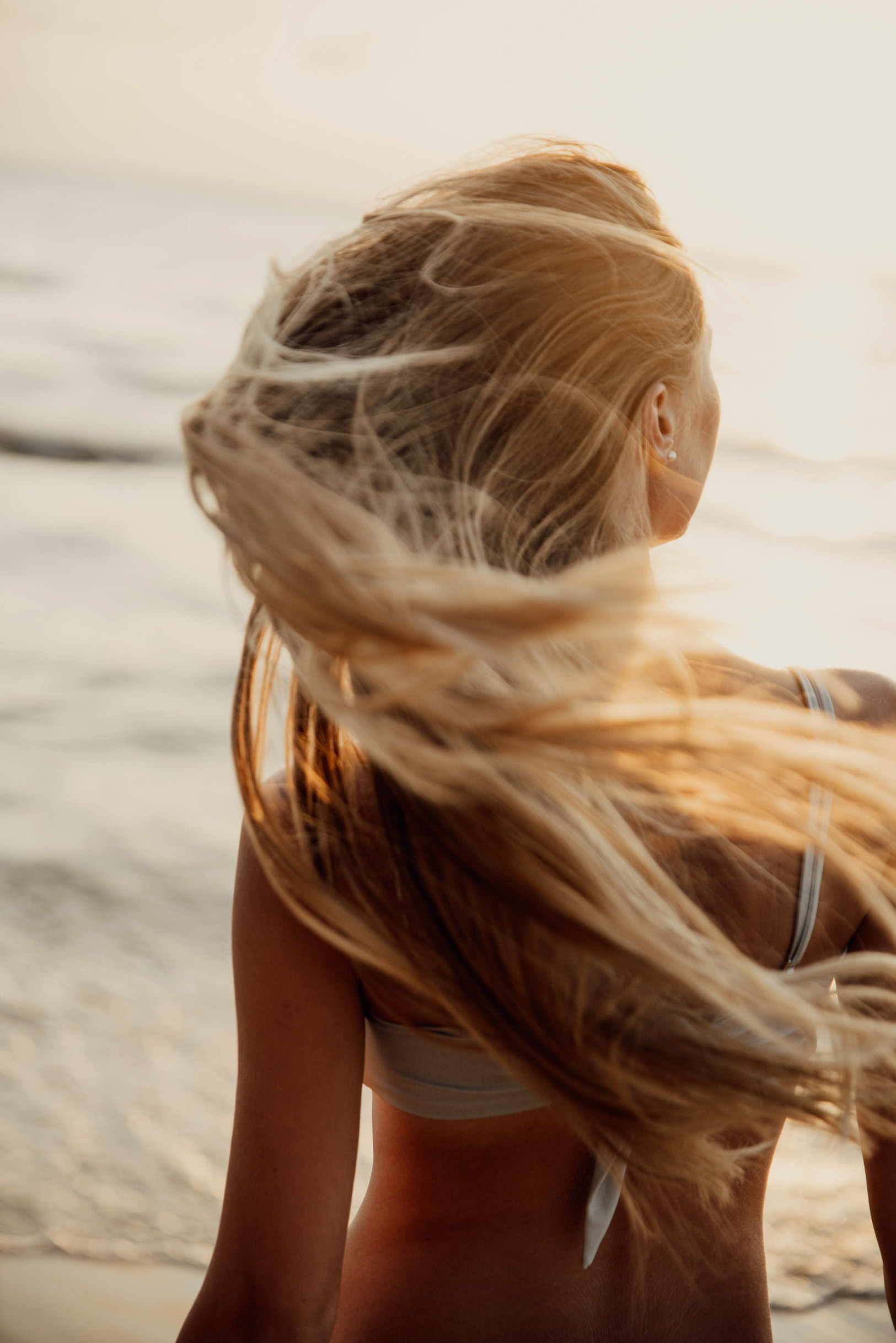 Sun-drenched hair in the Aegean wind.